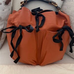 Orange Marni Leather Women's Bag with Black Ribbon ties..